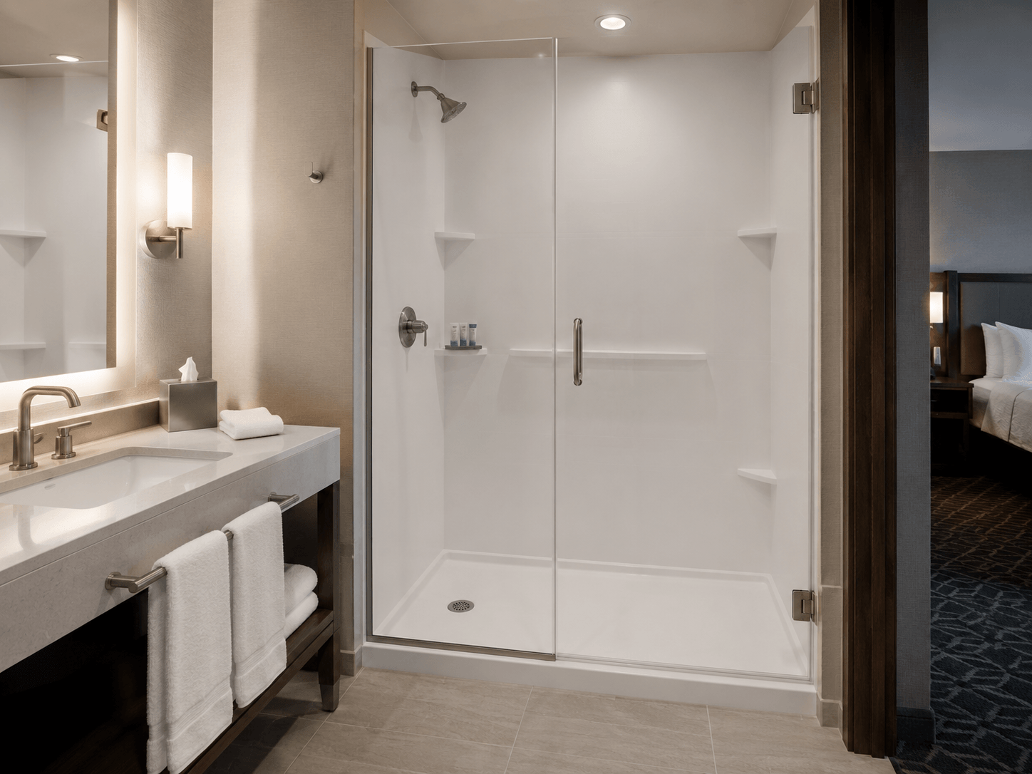 A picture of a shower and sink in a residential bathroom.