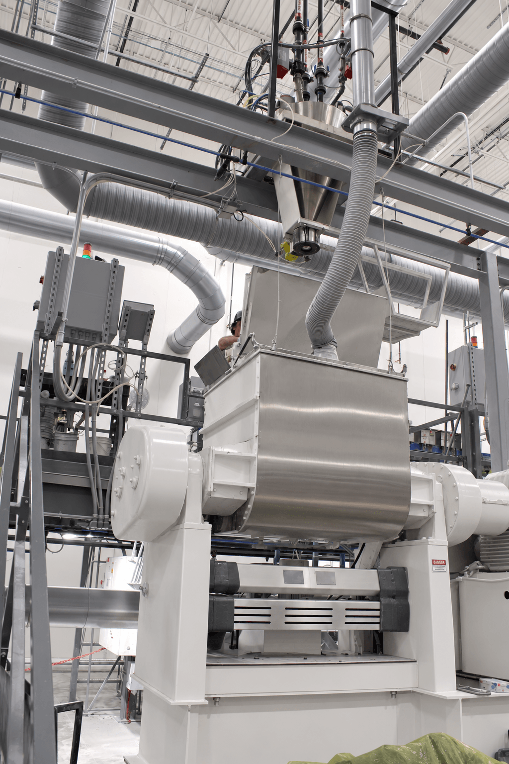 A BMC Mixer on a manufacturing floor.
