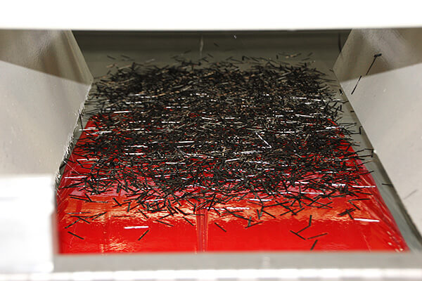 Chopped carbon fiber on red SMC paste