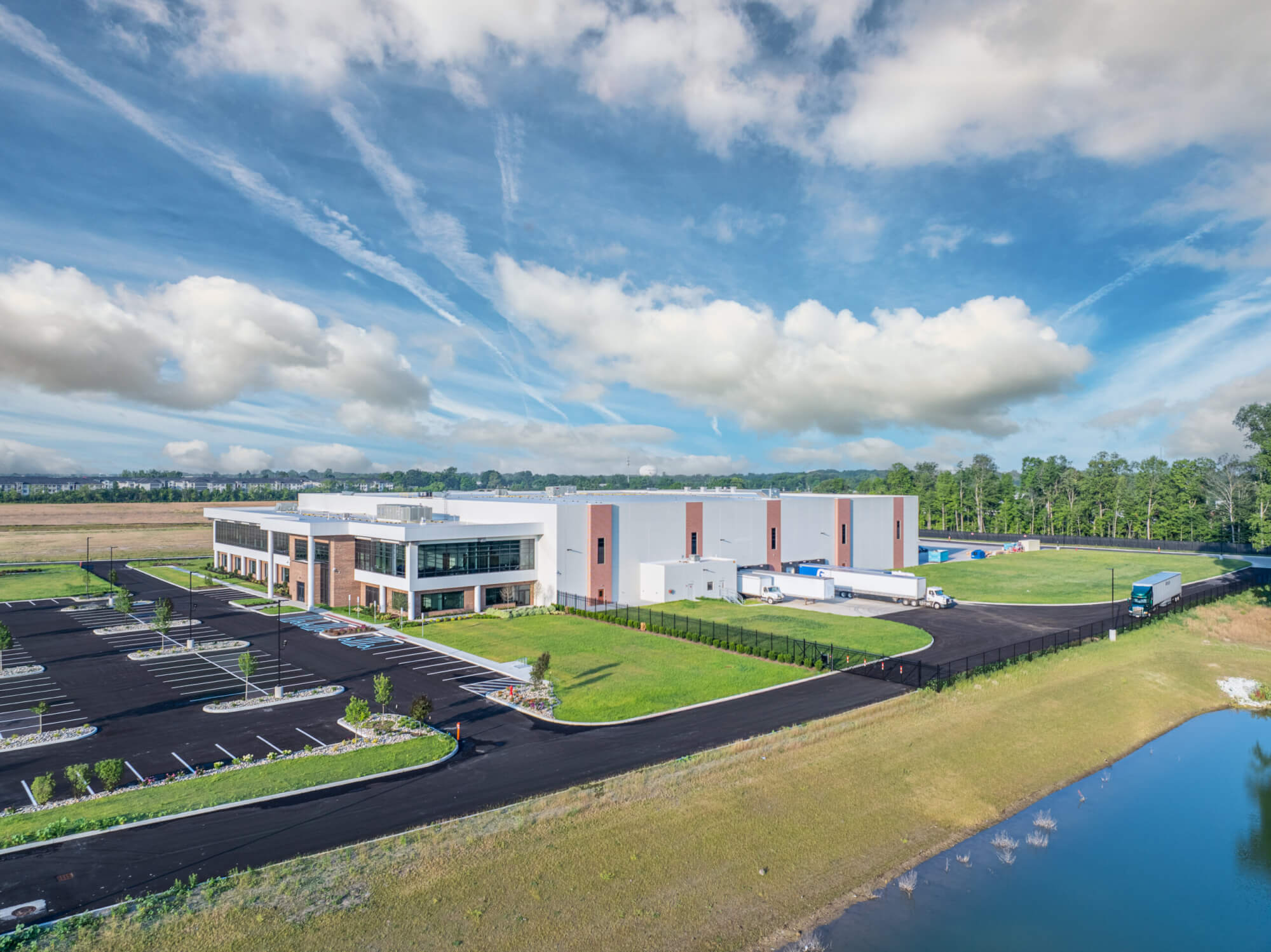 Aerial view of a large manufacturing facility on a sunny day.