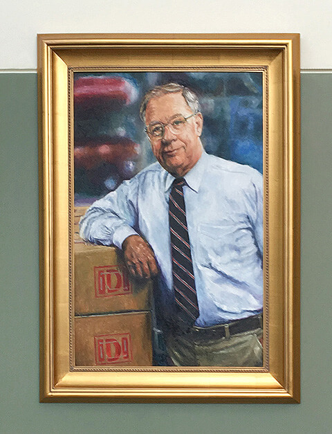 A portrait of John K. Merrell framed in a gold frame.